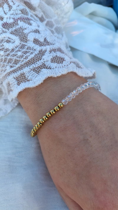 PULSERA CRISTAL BLANCA ACERO DORADO