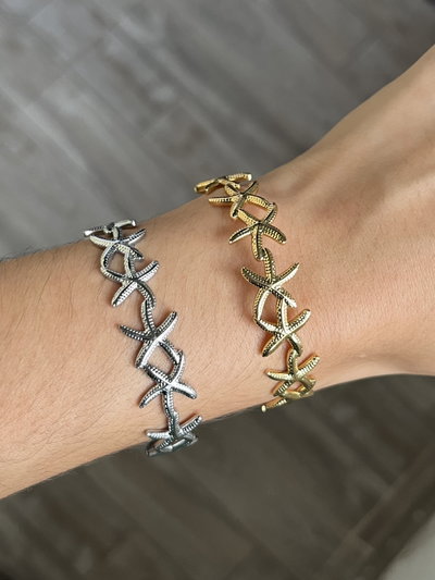 Pulsera estrella de mar en acero dorado y quirúrgico 