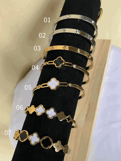 Esclavas de acero dorado y quirúrgico