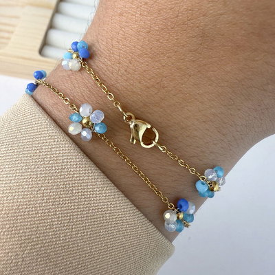 PULSERA ACERO DORADO FLORCITAS TONOS CELESTES