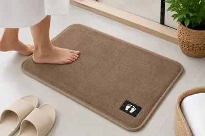Alfombra de baño suave piecitos 58x38 cm base antideslizante 