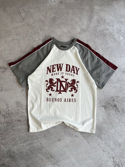 Remera over New Day intermedia