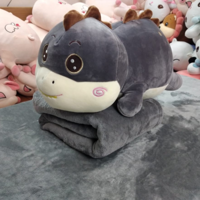 peluche dino con manta