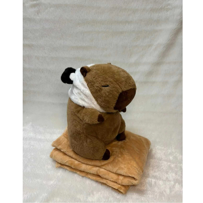 peluche capibara con manta