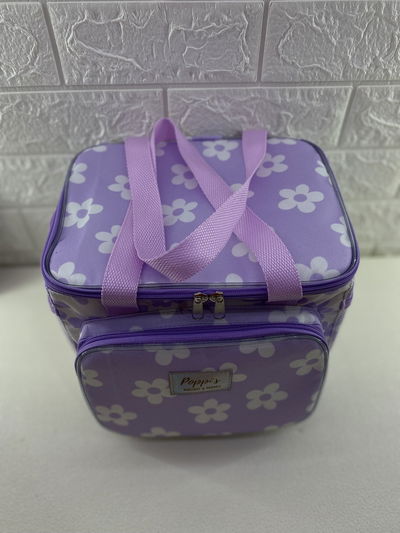 Lunchera térmica lila con flores blancas