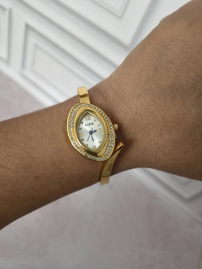 RELOJ  SOFITEL DORADO