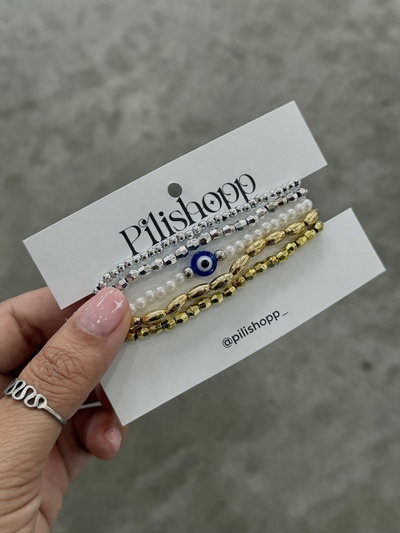 Set pulseras plat y dorado ojito 
