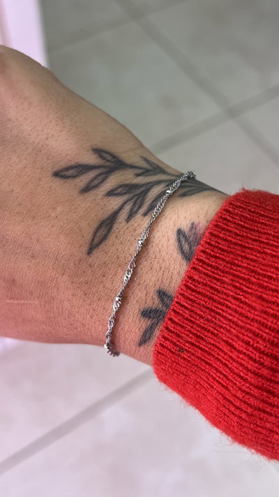 Pulsera acero trenzada/pelotitas 