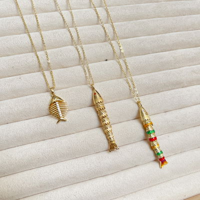 Collares de Peces en Acero Dorado
