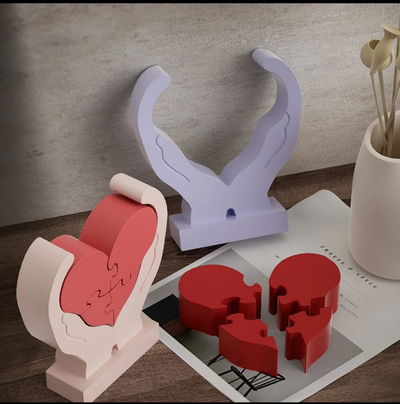 manos con corazon rompecabeza