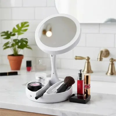 Espejo con luz portátil