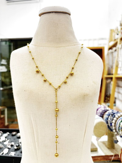 collar bolitas acero dorado corbatero