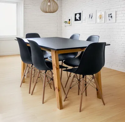 MESA 1.40 CON 6 SILLAS EAMES NEGRAS