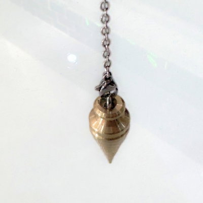 Péndulo cónico de bronce