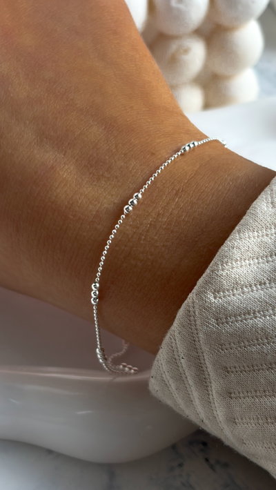 Pulsera brillo triple bolitas x18