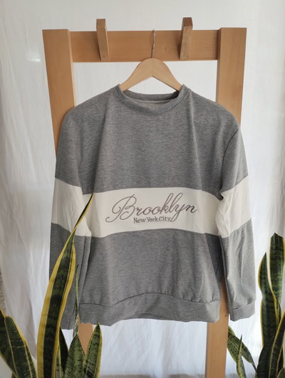 BUZO FRIZADO COMBINADO CON BORDADO