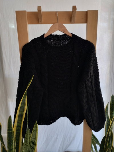Sweter clasico con trenzas