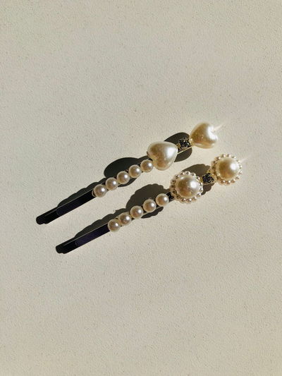 Hebillas perlas florcita y corazón