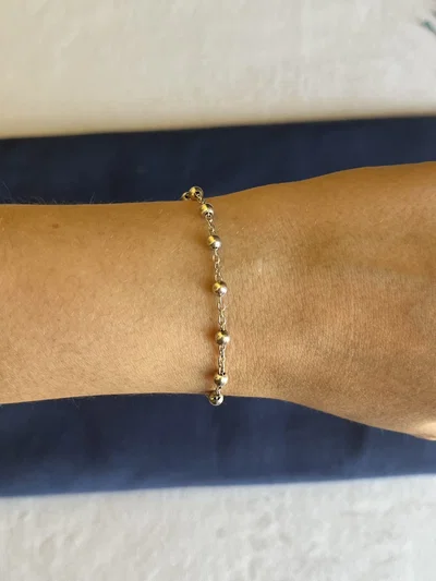 Pulsera bolitas y cruz