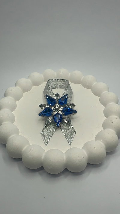 ESCARAPELA CON STRASS 