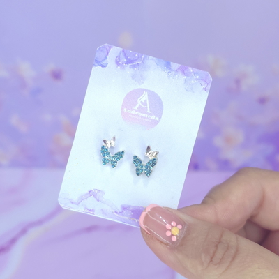 Aros pasante mini mariposa stras celeste AQ