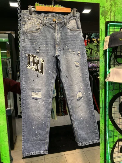 JEANS RECTO AMIRI LOGO ROTURAS Azul