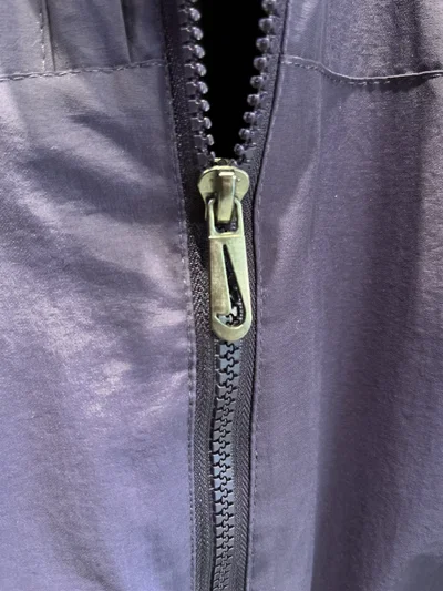 CAMPERA ROMPEVIENTO NIKE NOCTA Morada con lila