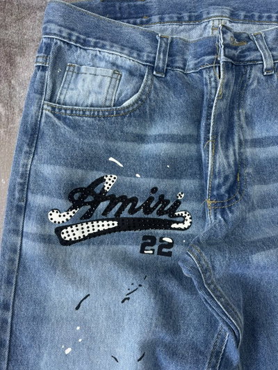 JEANS RECTO AMIRI MANCHAS Y STRASS Azul