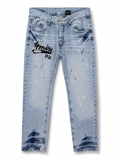 JEANS RECTO AMIRI MANCHAS Y STRASS Celeste