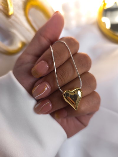 Cadena acero blanco con dije corazón dorado